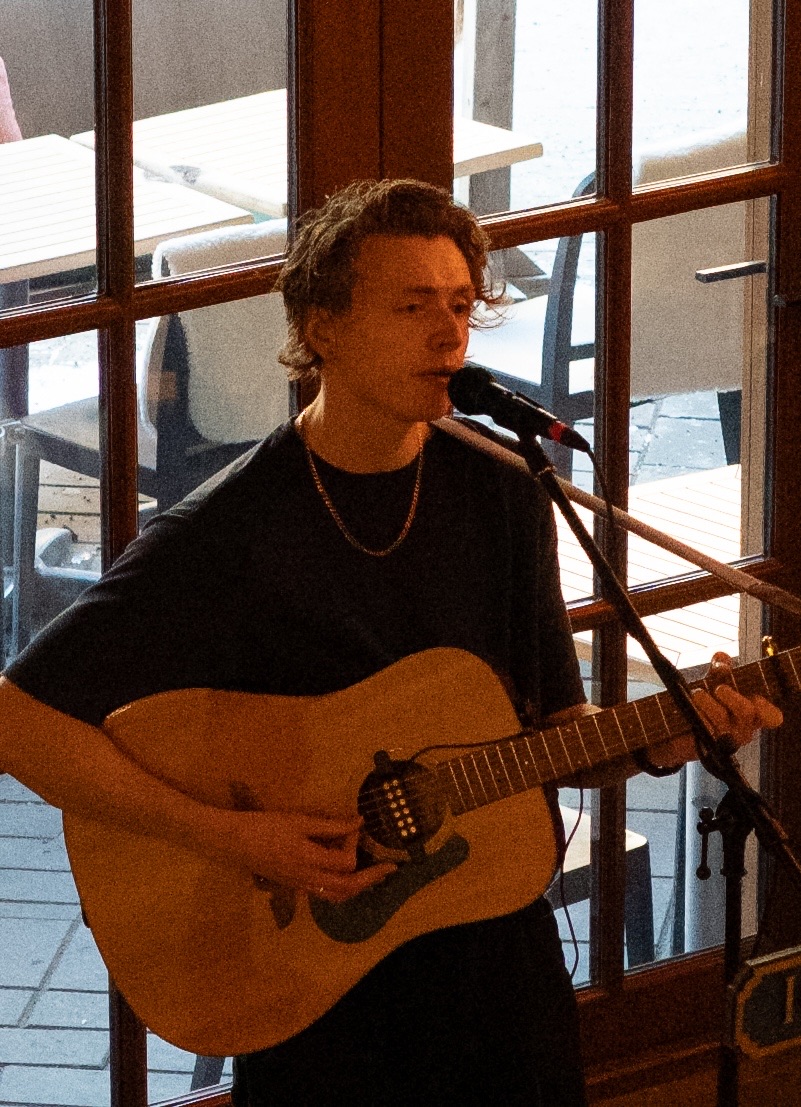 Liam performing live on acoustic guitar