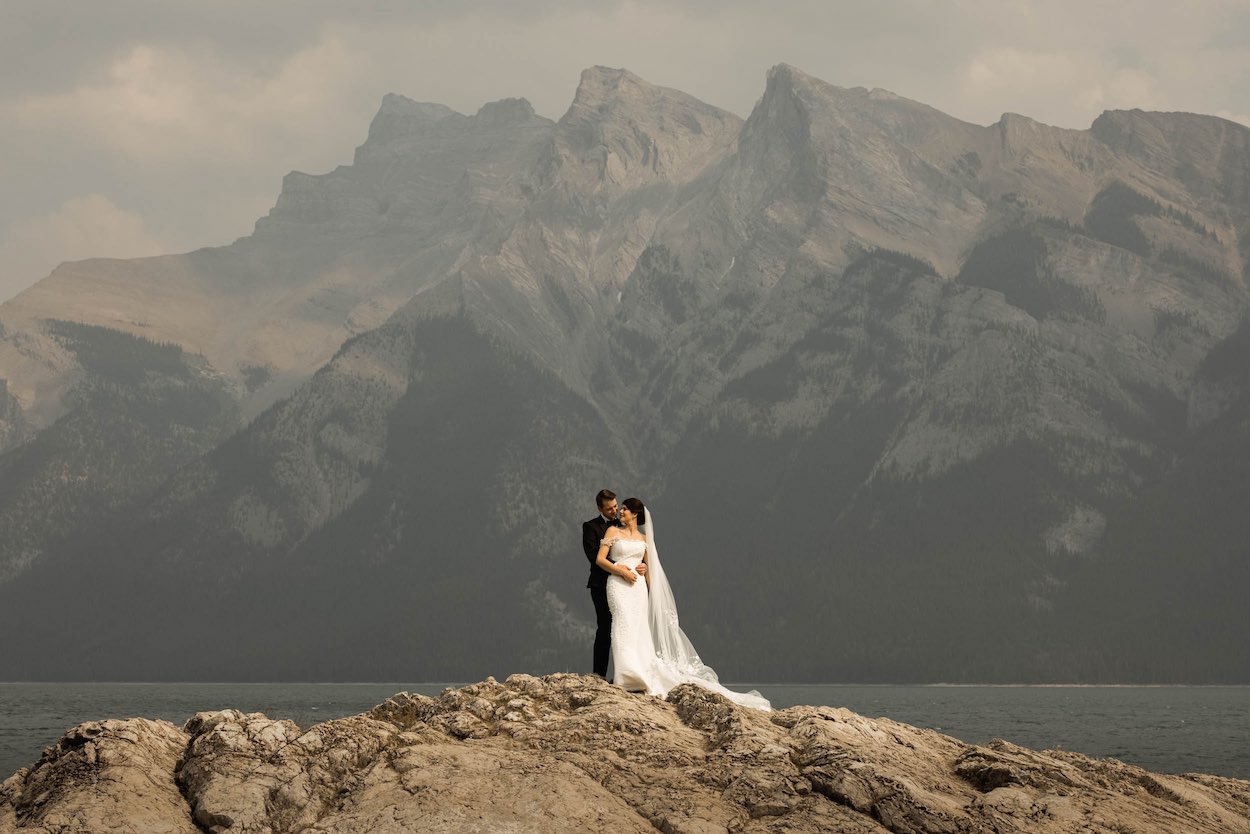 Acoustic guitarist performing at an outdoor Banff wedding ceremony